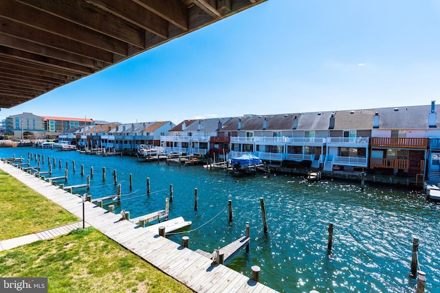 dock area featuring a residential view and a water view