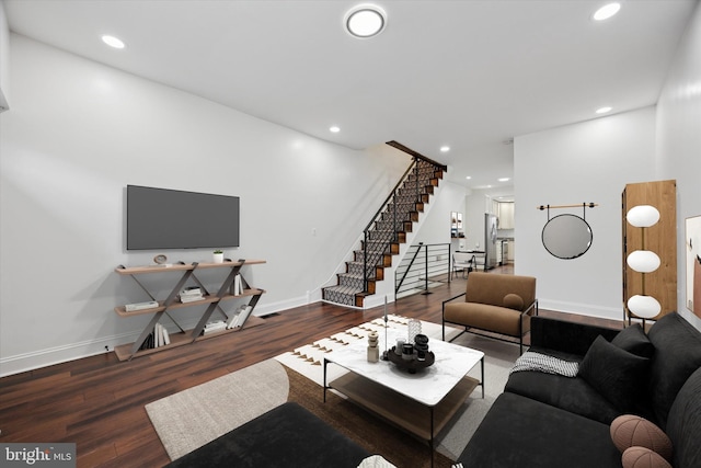 living room featuring stairway, recessed lighting, wood finished floors, and baseboards