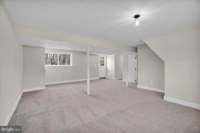 basement featuring carpet and baseboards