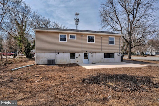 back of house with cooling unit and a patio