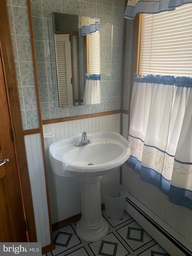 bathroom featuring tile patterned floors and a baseboard radiator