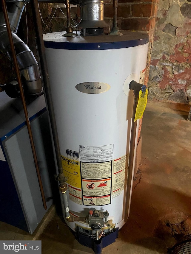 utility room featuring gas water heater