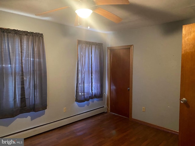 unfurnished bedroom with a ceiling fan, wood finished floors, and baseboard heating