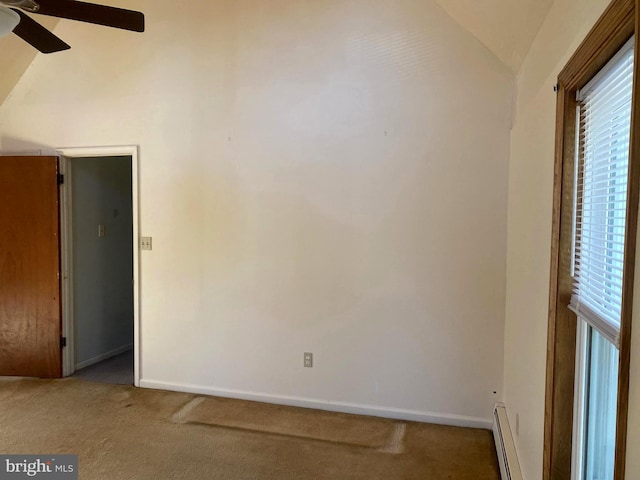 unfurnished room with a ceiling fan, baseboards, carpet flooring, a baseboard radiator, and lofted ceiling