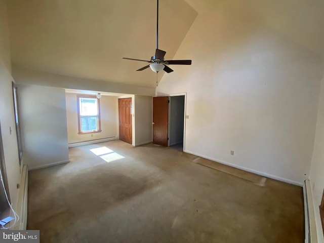 unfurnished bedroom featuring a towering ceiling, baseboards, baseboard heating, and light carpet