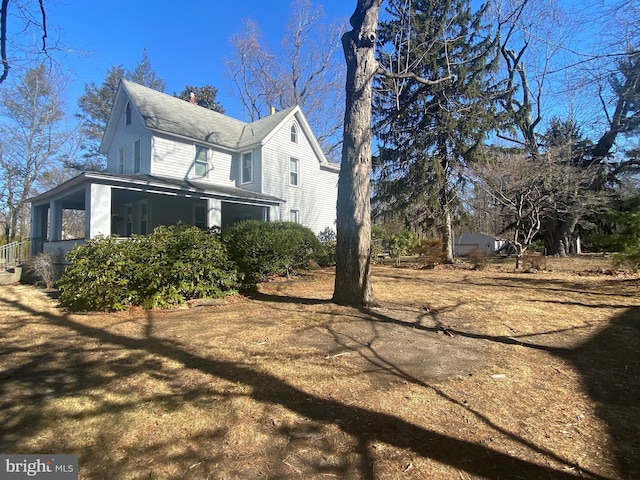 view of property exterior featuring a chimney