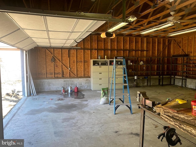 garage with concrete block wall