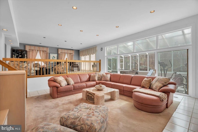 living room with tile patterned flooring and recessed lighting