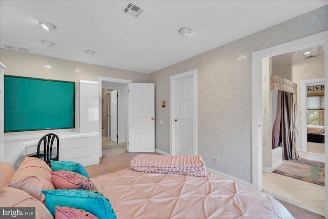 bedroom with baseboards and visible vents