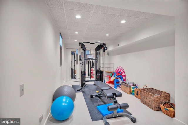 workout room with recessed lighting and a drop ceiling