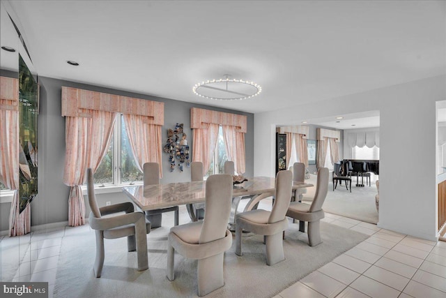 dining space with light tile patterned floors