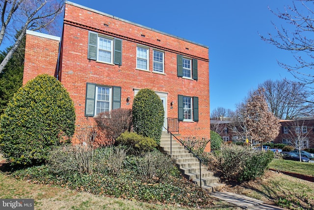 view of front of property featuring brick siding