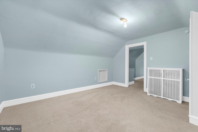 bonus room featuring vaulted ceiling, baseboards, and carpet floors