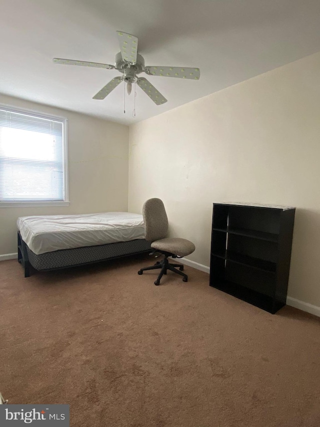 bedroom with baseboards, carpet floors, and ceiling fan