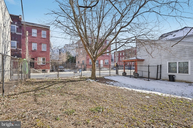 view of yard featuring a residential view and fence