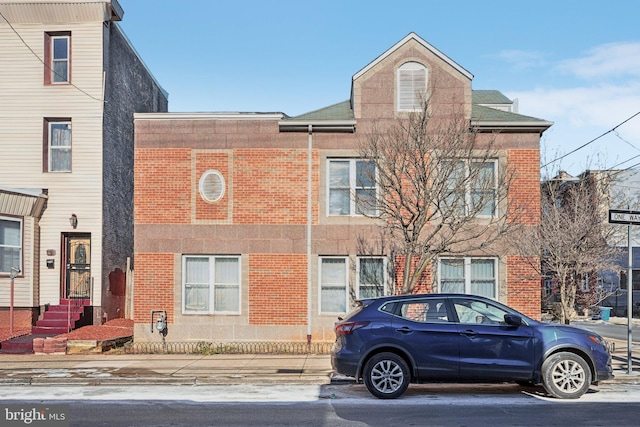 multi unit property featuring brick siding
