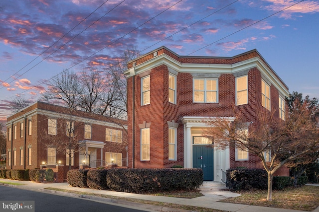 view of front of home with brick siding