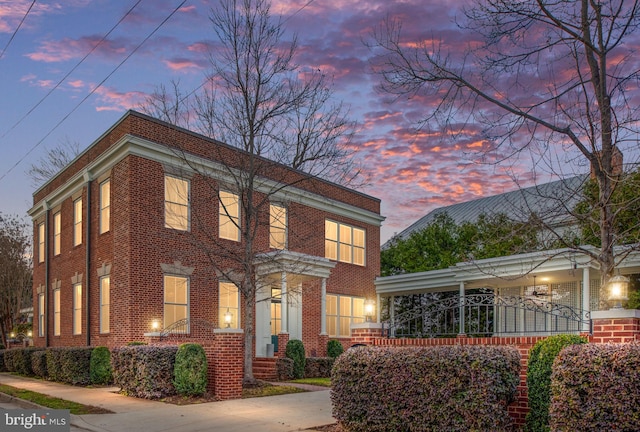 view of front of house with brick siding