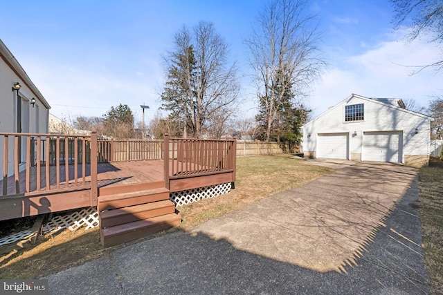 view of yard featuring a wooden deck and fence