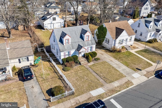 birds eye view of property with a residential view