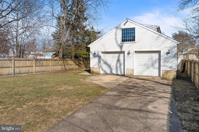 detached garage featuring fence