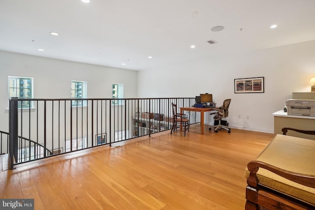 office with recessed lighting, visible vents, baseboards, and wood finished floors