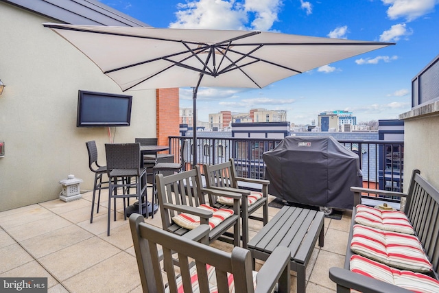 view of patio with a balcony and grilling area