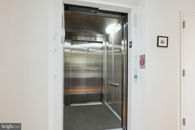 interior details with elevator and carpet