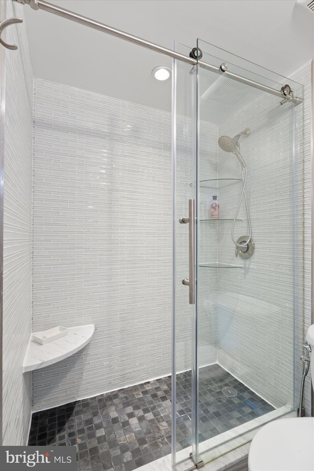 bathroom with a shower stall