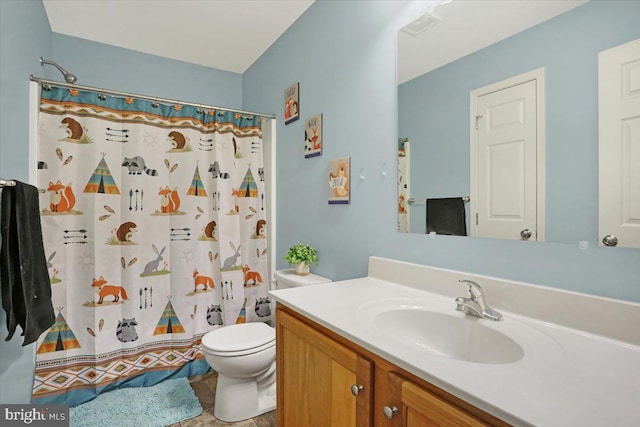 bathroom with a shower with shower curtain, toilet, vanity, and visible vents