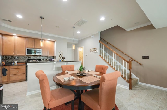 dining room featuring visible vents, ornamental molding, stairway, and recessed lighting