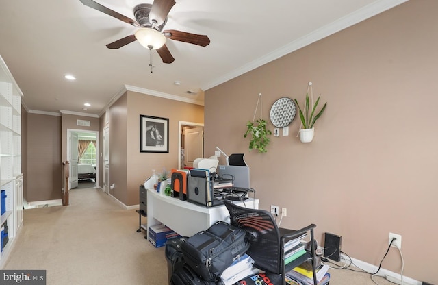 office area featuring ceiling fan, light carpet, ornamental molding, and baseboards