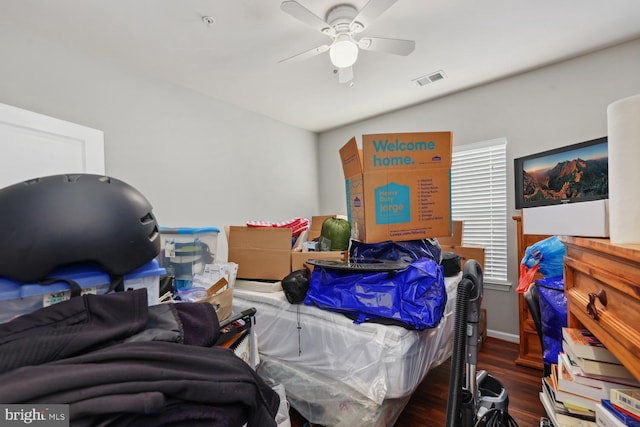 bedroom featuring wood finished floors, ceiling fan, and visible vents