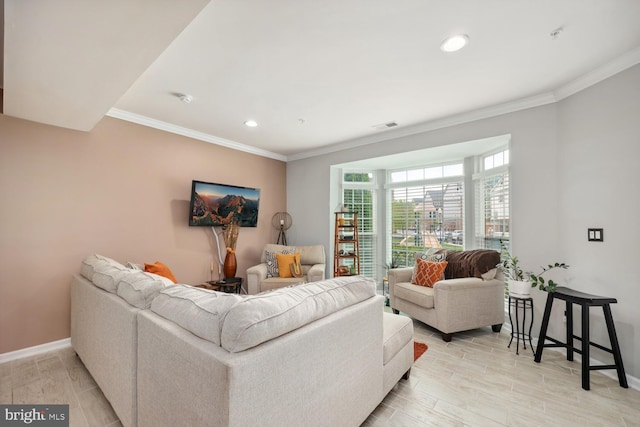 living area featuring recessed lighting, light wood finished floors, visible vents, baseboards, and ornamental molding