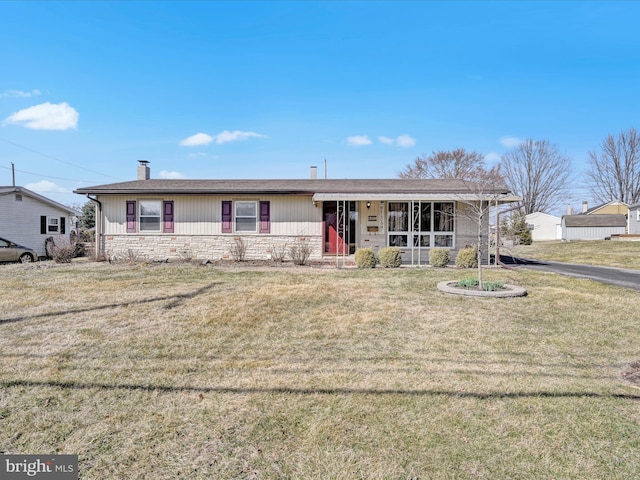 single story home with a front lawn, stone siding, and a chimney