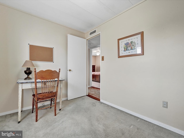 office space with visible vents, baseboards, and carpet floors