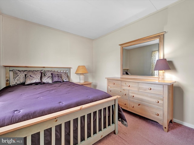 bedroom featuring carpet flooring and baseboards