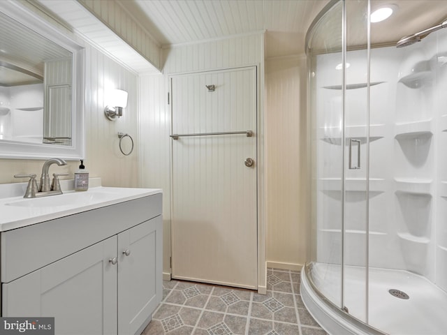 full bath featuring vanity and a shower stall