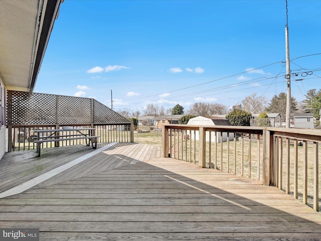 deck featuring an outdoor structure