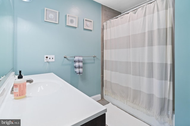 bathroom featuring vanity and a shower with curtain