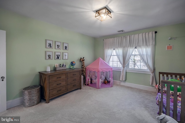 bedroom featuring visible vents, carpet flooring, and baseboards