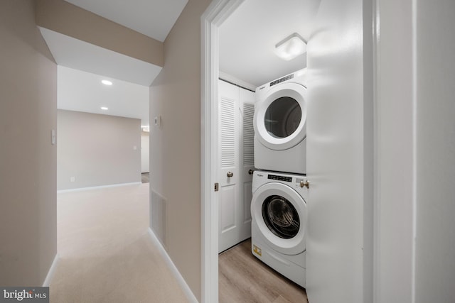 11305 Commonwealth Dr Unit 302, Rockville, MD 20852 - laundry area featuring estacked washer and dryer, recessed lighting, and baseboards