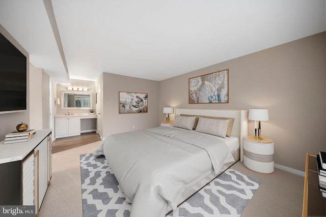 11305 Commonwealth Dr Unit 302, Rockville, MD 20852 - bedroom with light colored carpet, connected bathroom, and baseboards