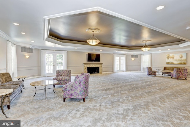 11305 Commonwealth Dr Unit 302, Rockville, MD 20852 - carpeted living room with a raised ceiling, crown molding, plenty of natural light, a decorative wall, and french doors