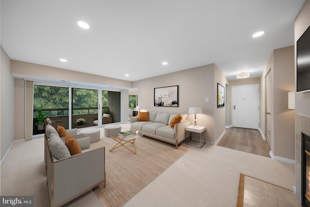 11305 Commonwealth Dr Unit 302, Rockville, MD 20852 - living room featuring light carpet, recessed lighting, a tiled fireplace, and baseboards