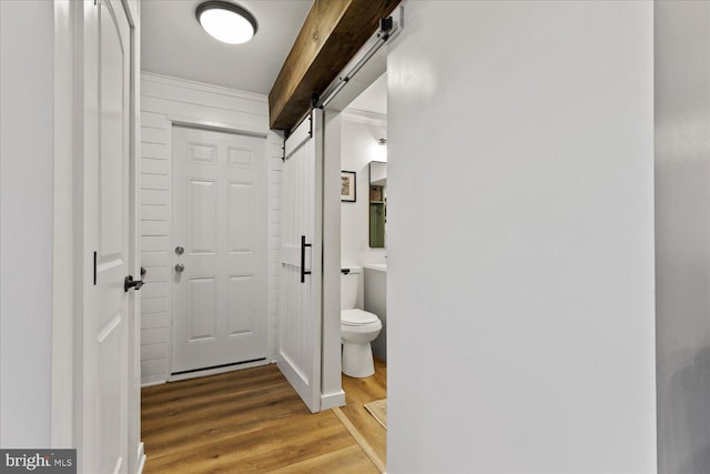 interior space with toilet and wood finished floors