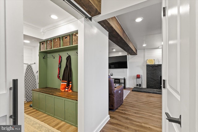 mudroom featuring recessed lighting, crown molding, and wood finished floors