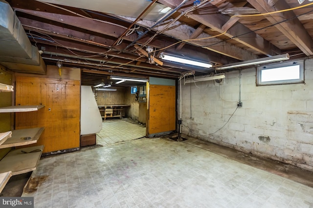 basement with tile patterned floors