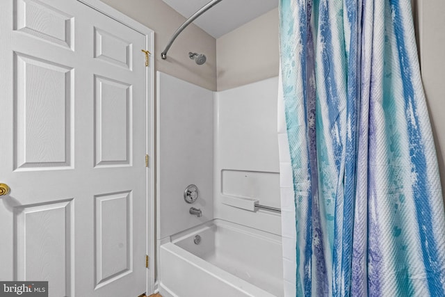 full bathroom featuring shower / bath combination with curtain