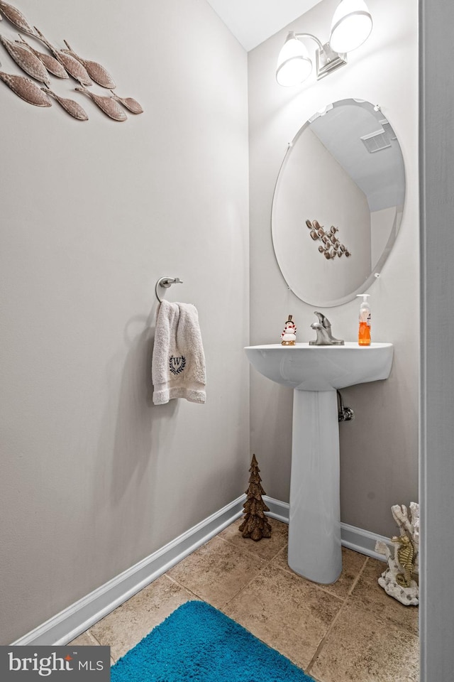 bathroom featuring tile patterned flooring and baseboards